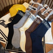 秋冬加厚羊绒中长筒袜子女欧货字母D保暖舒适搭配博肯雪地靴