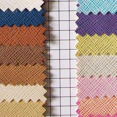 半PU荔枝纹皮革 人造革库存面料箱包革文具包装发泡革厂家