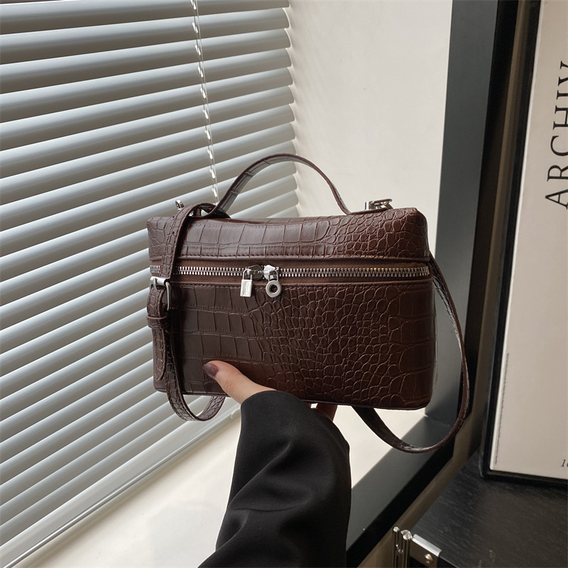 2025 textura simple bolso pequeño portátil nuevo bolso cuadrado pequeño de moda de moda bolso de mensajero de paso de alta gama