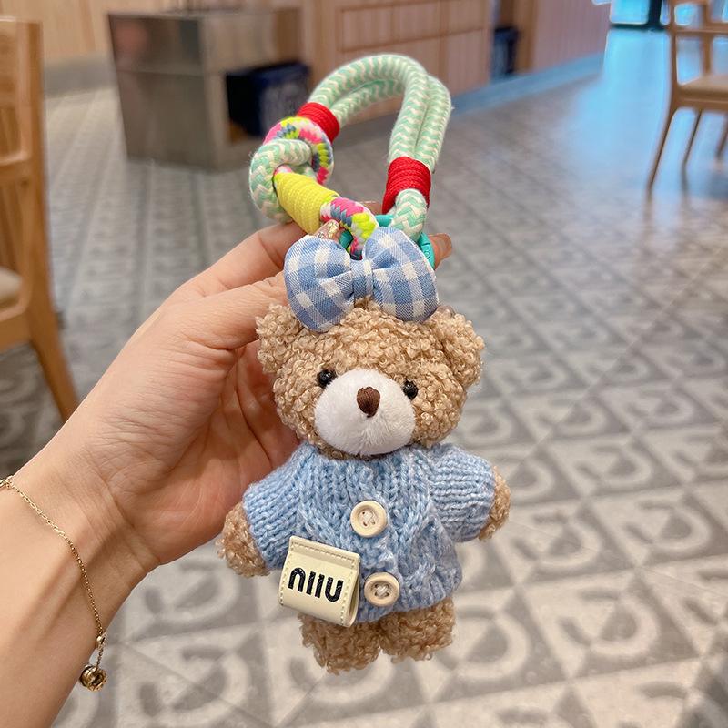 新商品のアニメの蝶結びのセーターの熊の車のキーホルダーのアイデアのぬいぐるみのカバンの装飾の女性