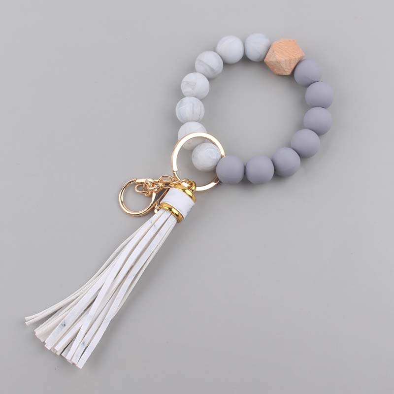 Nuevo cuero creativo pu borla colgante silicona muñeca llavero colgante silicona cuentas pulsera llavero