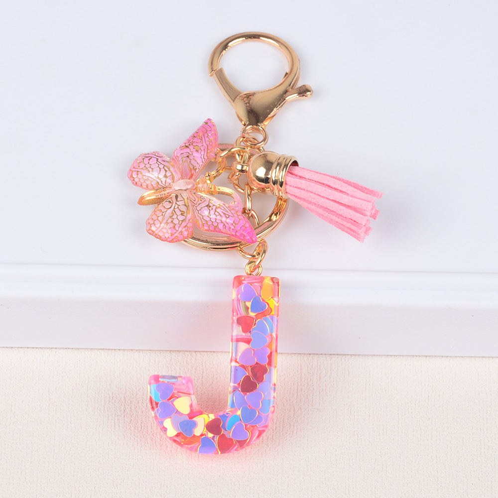 Explosiones transfronterizas amor sequillas iniciales llavero al por mayor resina letra mariposa fringe llavero se puede personalizar