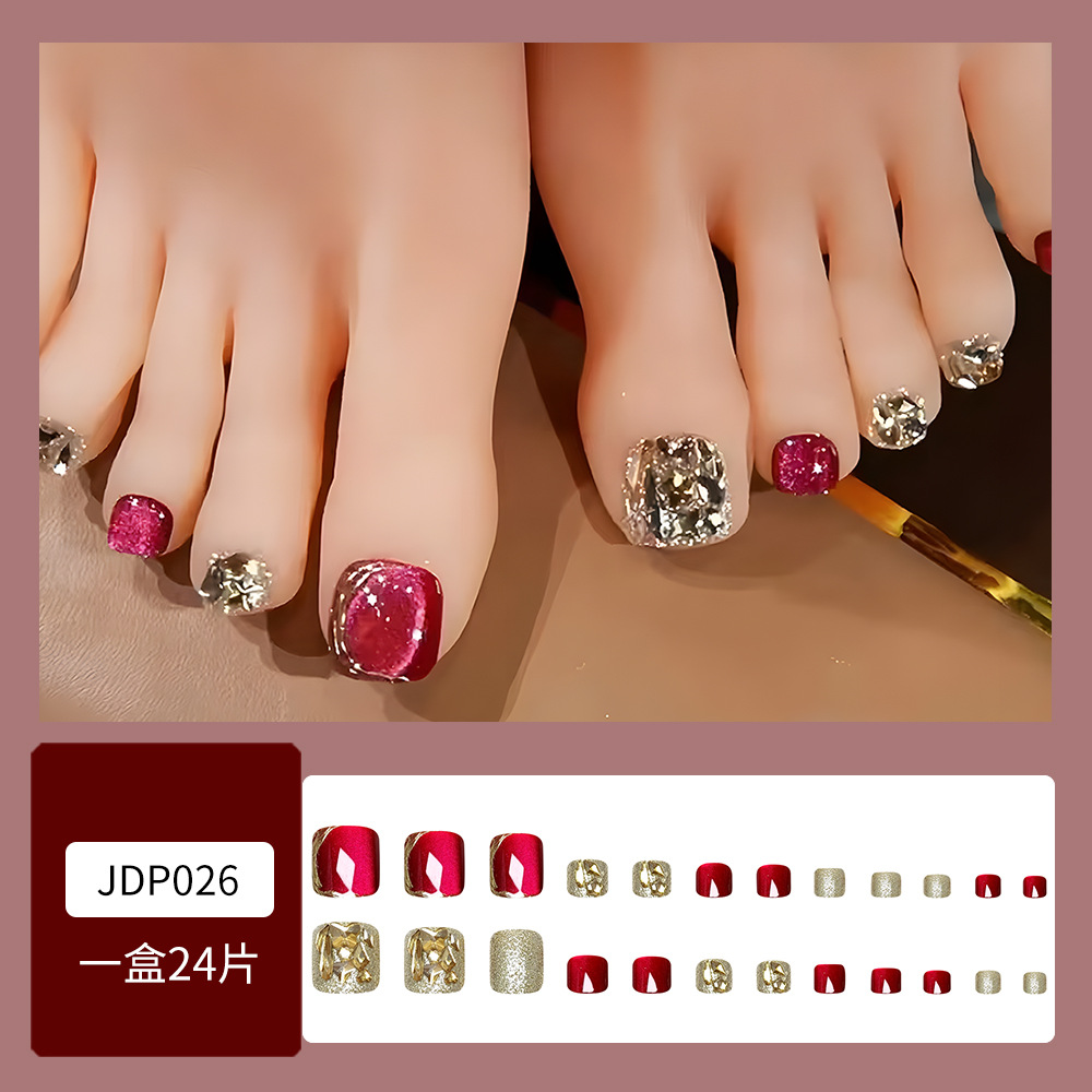 Tabletas de uñas de diamantes de imitación dulces y frescos, uñas de vestir de ojo de gato con borde dorado rojo, brillo dulce, parche de uñas explosivo terminado