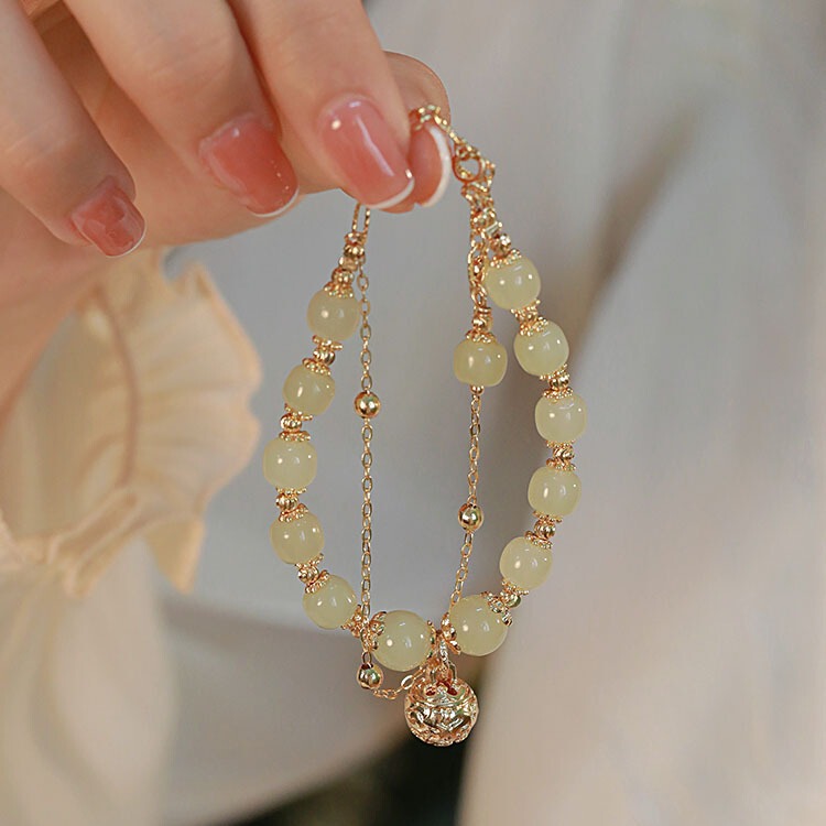 Natural Hetian Jade Bell bracelet female light luxury Jade high-end niche design simple girlfriends bracelet one step at a time