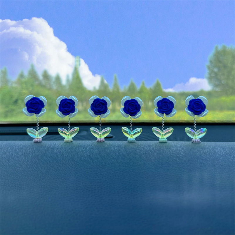 Tendencia nuevo producto flocado rosa coche sacudiendo la cabeza pequeños adornos decoración de primavera tablero accesorios de coche ventana