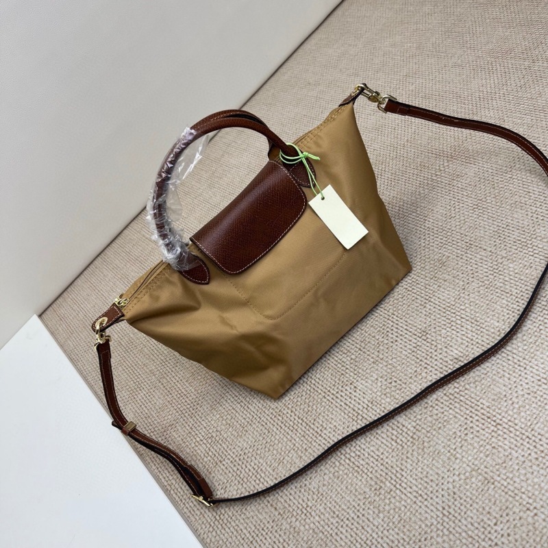 高品質の新しいショートハンドルの小さなハンドバッグ、女性用シングルショルダー、長いストラップ付き、パンチングクロスボディバッグ、ナイロン餃子バッグ|undefined