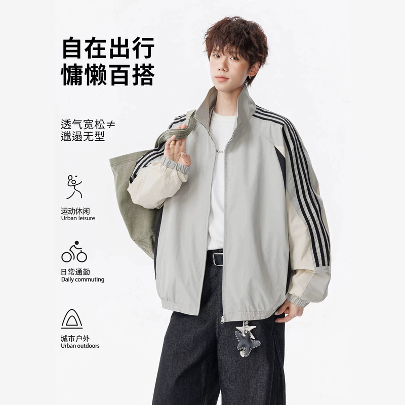 Color-blocked, patchwork-style, stand-up collar sports jacket with three stripes, raglan sleeves, loose fit, lightweight, and elastic hem – unisex