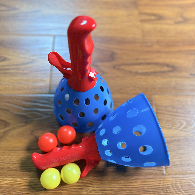 Red handle, ball catapult, mesh bag, 2 pieces