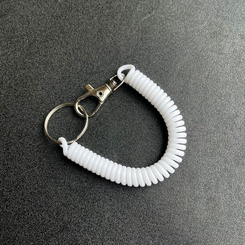 キャンディー色の高弾プラスチックは電話線のスプリングロープのキーチェーンをなくして携帯電話のカードカバーストラップのキーチェーンを包みます。|undefined