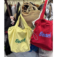 韩版帆布包2024ins新款日系单肩大容量手提袋抽绳通勤托复合布