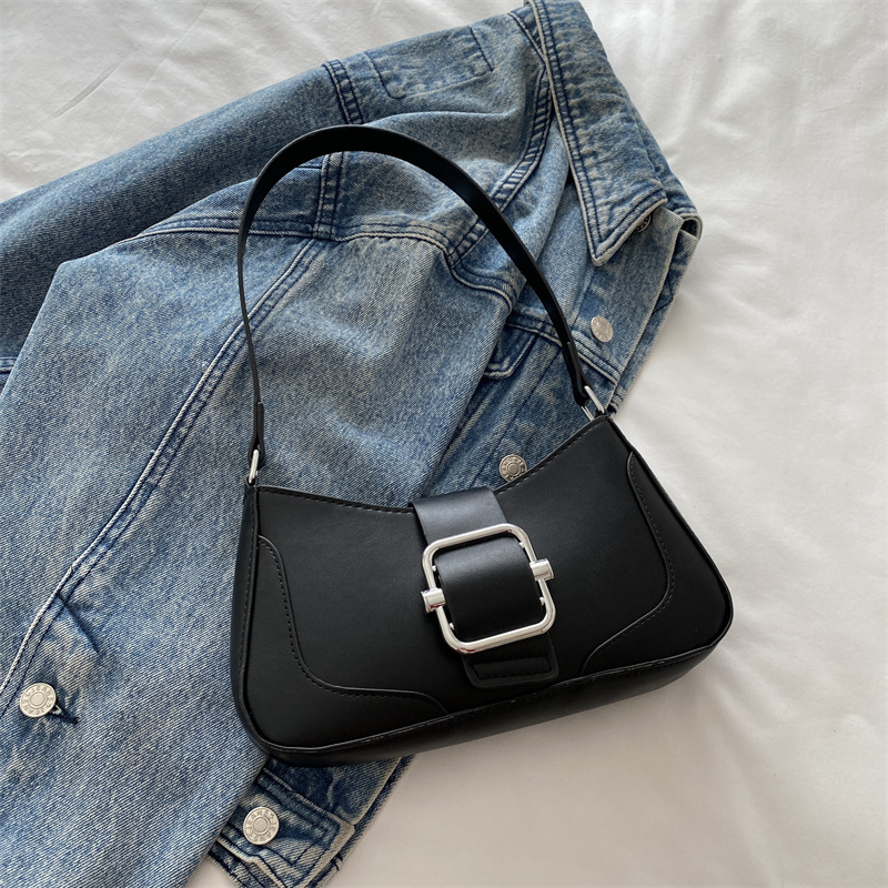 Versión coreana del bolso de axila de alta gama, popular de este año, bolso de palo francés de estilo occidental, diseño de nicho, bolso de hombro de temperamento de moda, viaje