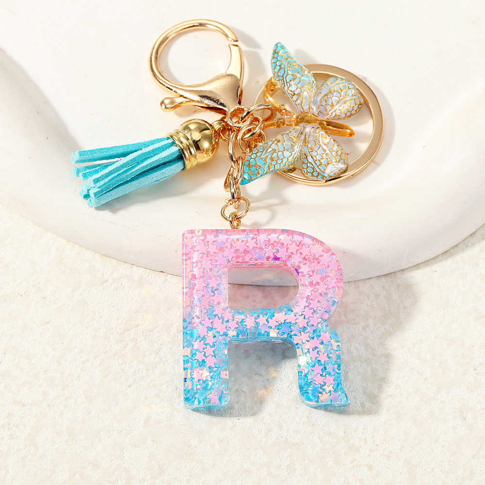 Europa y los Estados Unidos transfronterizos nuevos cristal sequinado goteo de goma letras inglesas joyería llavero y bolsos colgante apoyo al por mayor