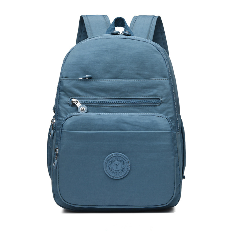 Mochila de hombro de comercio exterior 2025, nueva mochila de computadora simple de color sólido, mochila de escuela secundaria, mochila para hombres y mujeres.