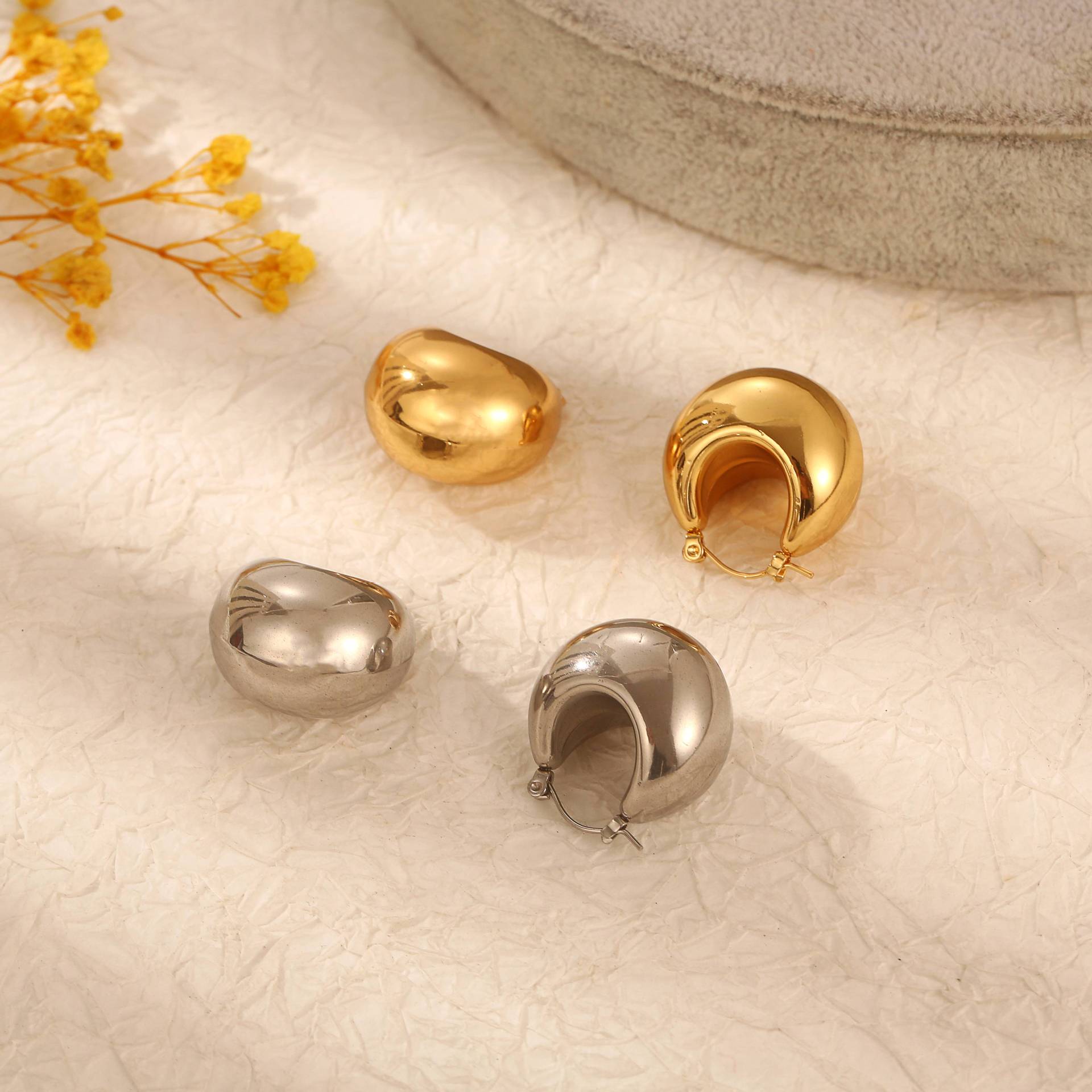 INS redondo de acero inoxidable hueco pendientes Chubby Dudu irregular bola oreja hebilla moda europea y americana joyería personalizada