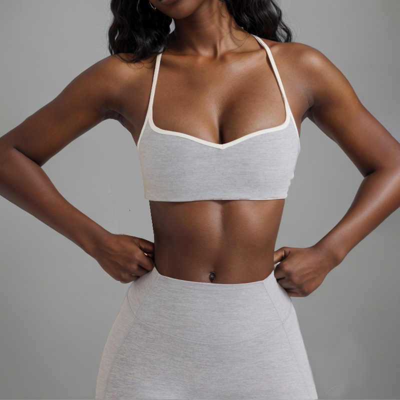 Procesamiento personalizado OEM comercio exterior europeo y americano transfronterizo belleza espalda deporte contraste color sujetador melocotón cadera alta cadera elástica pantalones de yoga