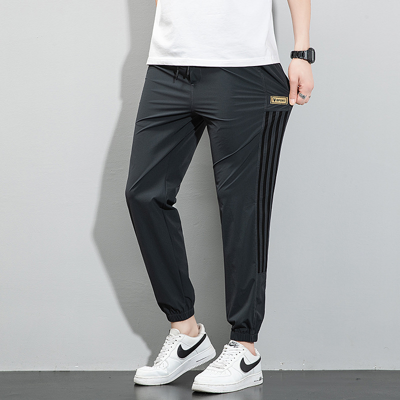 Pantalones de seda de hielo, pantalones deportivos de secado rápido de verano para hombres, pantalones casuales de nueve puntos sueltos y delgados de la marca de moda, pantalones casuales de nueve puntos al por mayor