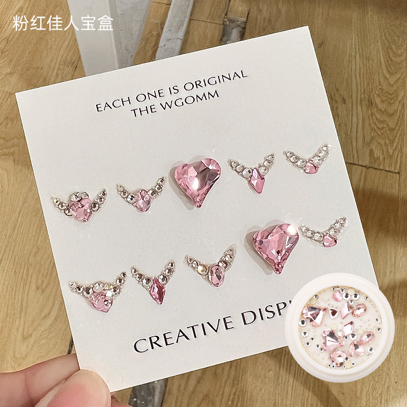 Desgaste de la celebridad en línea paquete de material de uñas caja del Tesoro japonés accesorios de uñas corazón torcido Mariposa Super Flash accesorios de uñas de diamante en forma especial