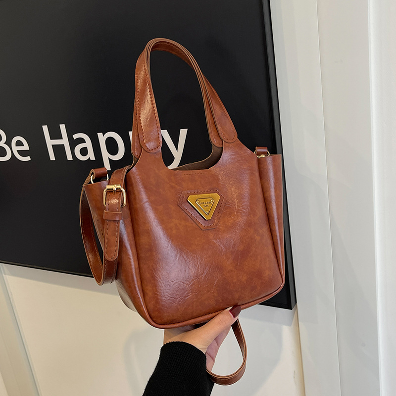 Bolso de cubo de mujer 2024 nuevo otoño invierno bolso retro de mano de viaje versátil bolso de hombro de mujer bolso de cubo de mujer