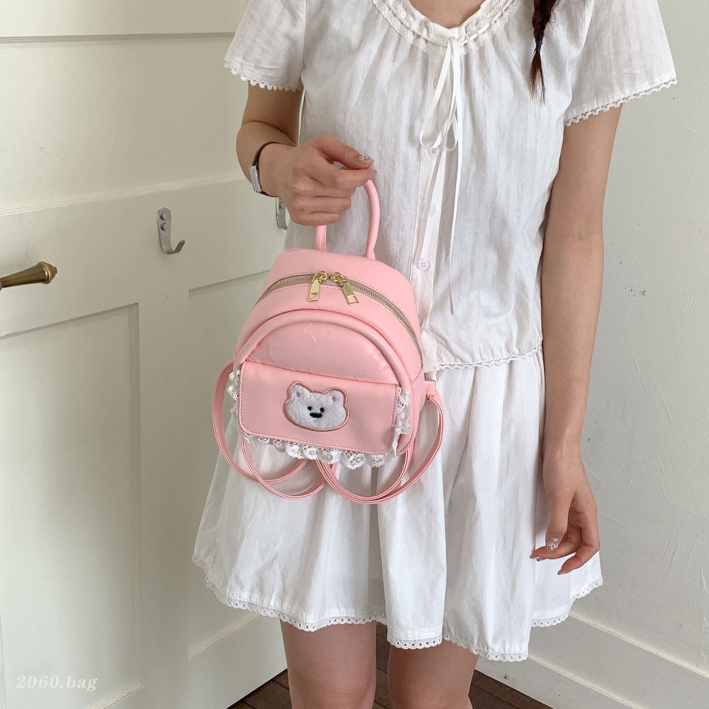 Mujeres nuevas estilos de dibujos animados simples estudiantes 2026 verano universal mochila ligera oso mochila encantador viaje coreano