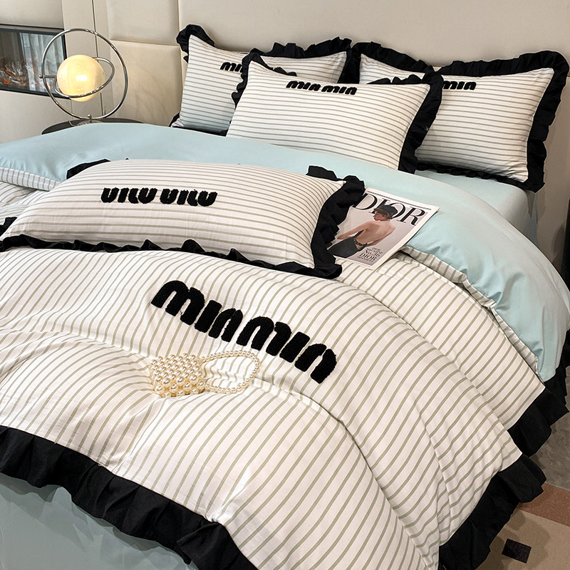 2024 nuevo estilo francés pequeño bordado de toalla de fragancia cuatro piezas funda de edredón sábana simple ropa de cama Nantong al por mayor