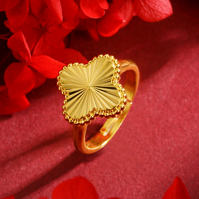 Flores de lujo ligero de cuatro hojas, anillos de flores de oro de arena vietnamita, estilo chino en vivo, explosión de la misma manera, simple y versátil.