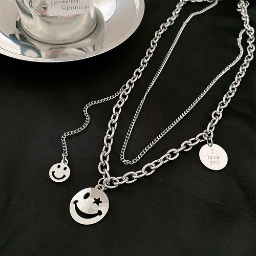 Instagram-worthy hip-hop smiley face necklace for women—delicate, minimalist design, lightweight luxury, niche aesthetic, made from titanium steel—perfect as a double-layered neck accessory.