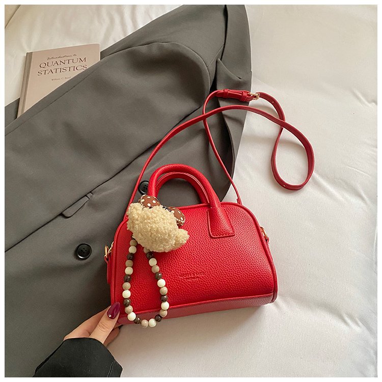 Bolsa de brazo retro nicho para mujeres 2026 nueva moda coreana bolsa de bolos portátil de gran capacidad bolso de hombro