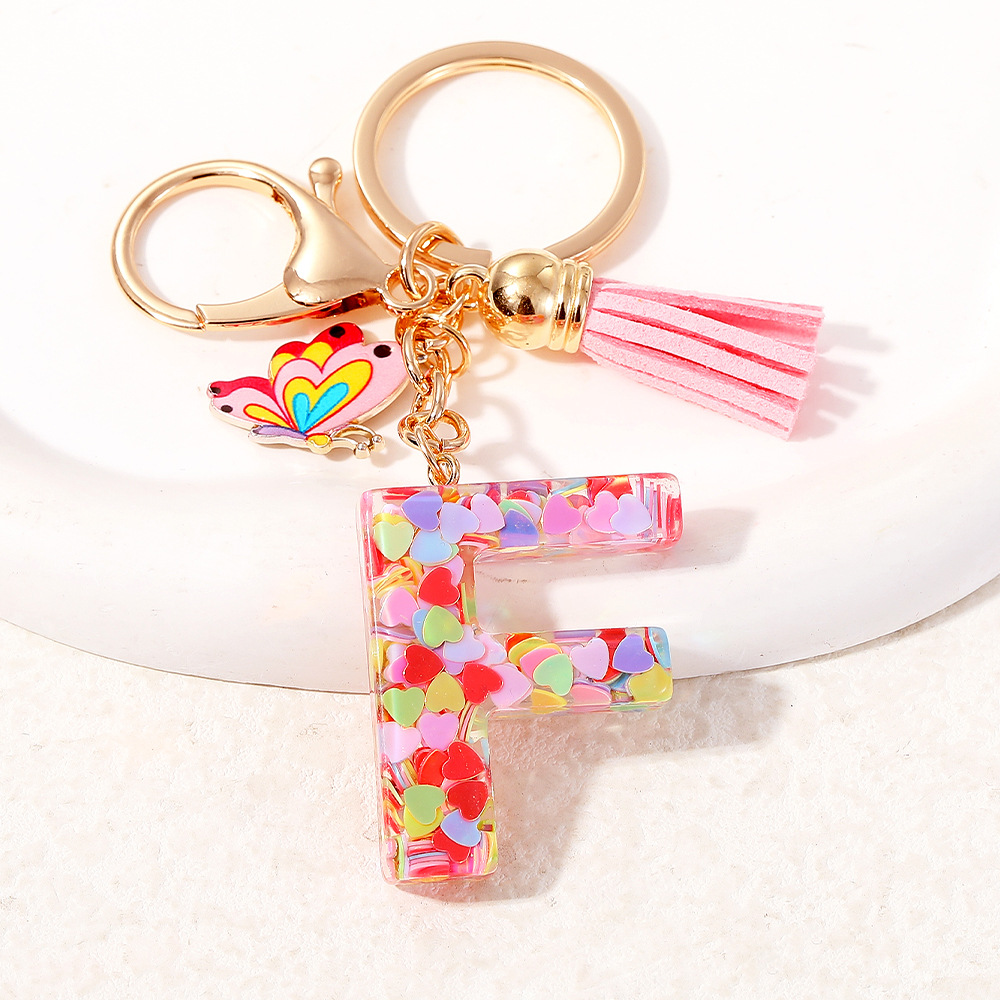 2024 puntos transfronterizos de resina de sequilla rosa 26 letras inglesas llavero colgante mariposa fringe accesorios