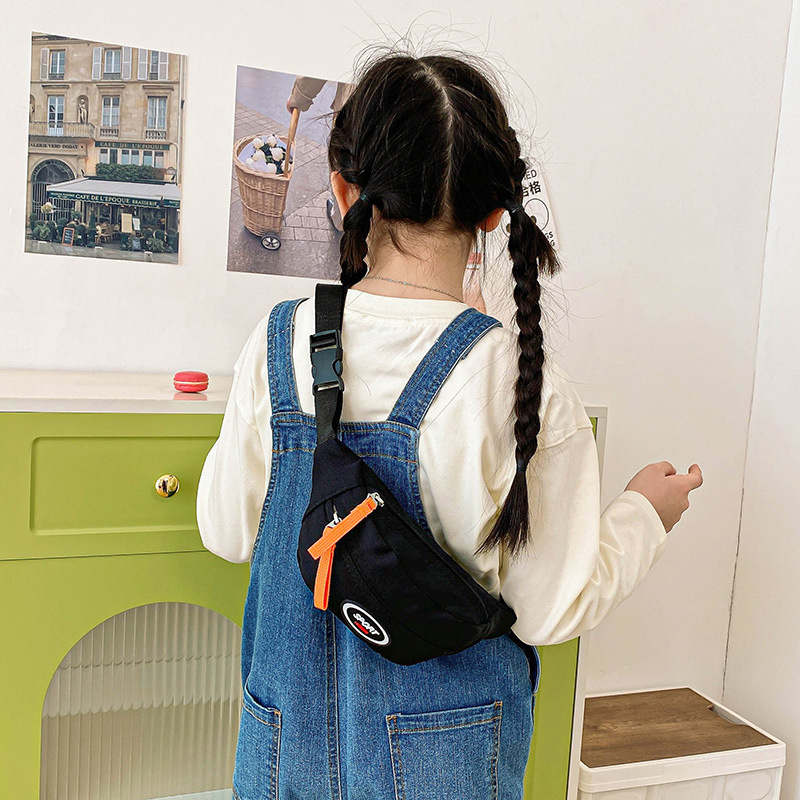 Bolso de pecho coreano para niños y niñas letras extranjeras de viaje ligero bebé mochila 2025 nuevo bolso de cambio para niños
