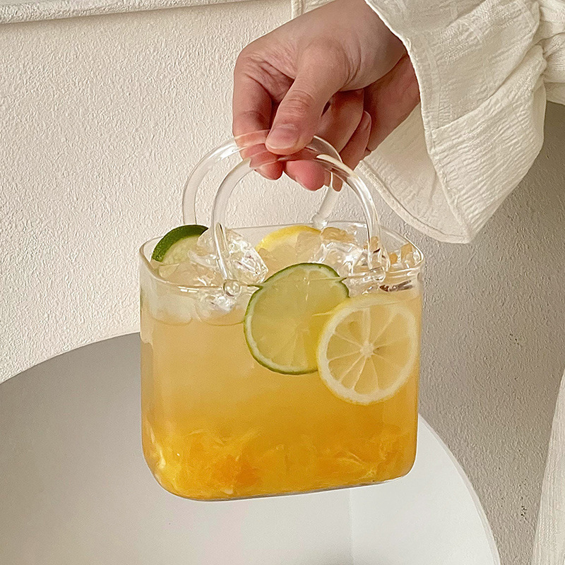 Bolso de vidrio en línea taza de té de frutas de verano transparente creativa extraña de alto valor de la cara taza de cóctel de jugo de fruta