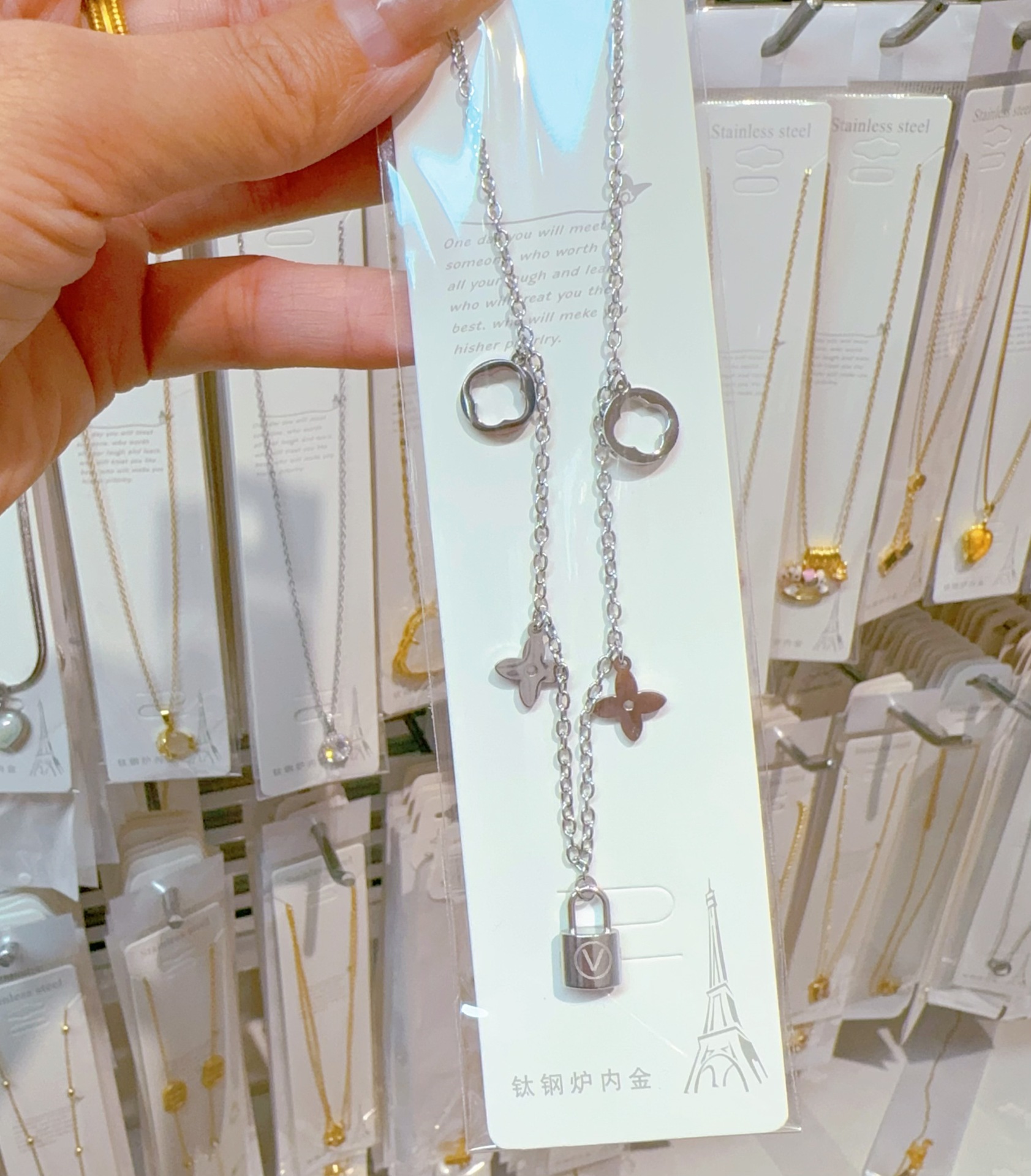 Steel necklace with letters, letter V