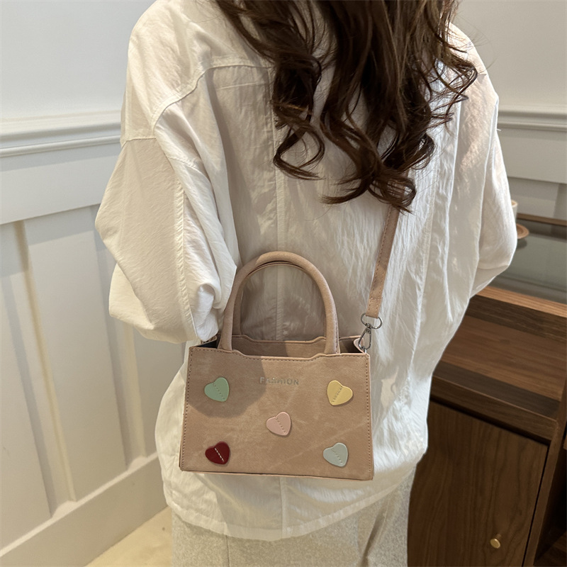 Bolso de mano de amor de la niña para mujeres 2024 nuevo bolso de hombro de verano de alta calidad sensación de super caliente bolso universal