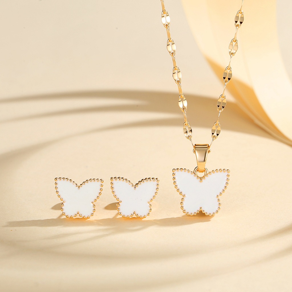 Europa y los Estados Unidos explotaron mariposa juegos de joyería de cobre dorado para mujeres pendientes de aceite goteo collar de seis colores joyerías transfronterizas en caliente