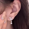 Earrings with bow drop-shaped with zircon, silver 6865 sample
