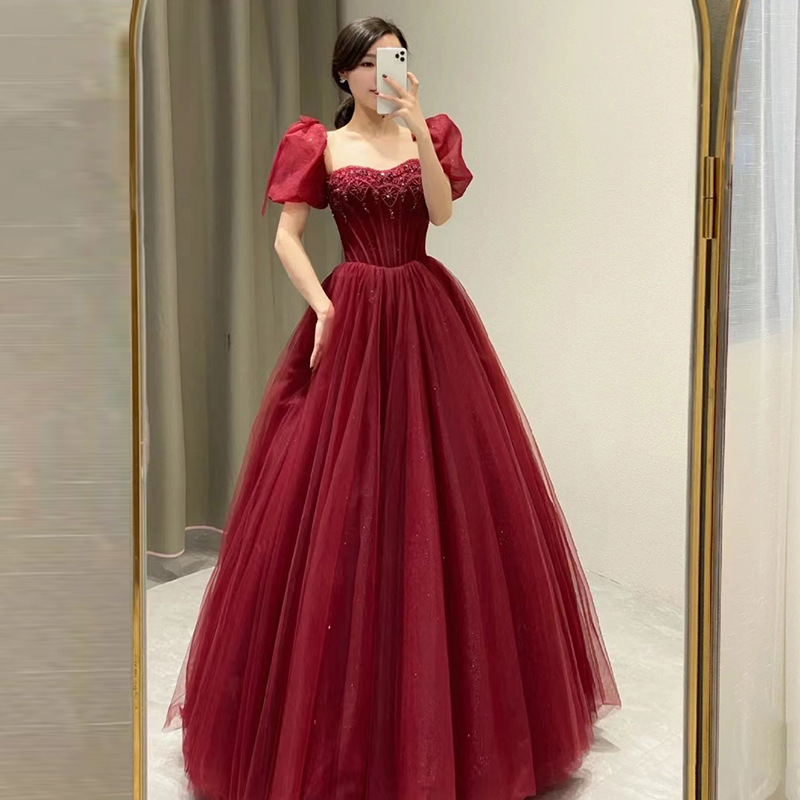 Nuevo cuello cuadrado burbuja manga vestido vino rojo 2026 estilo francés temperamento de alta sensación vestido de compromiso brindis