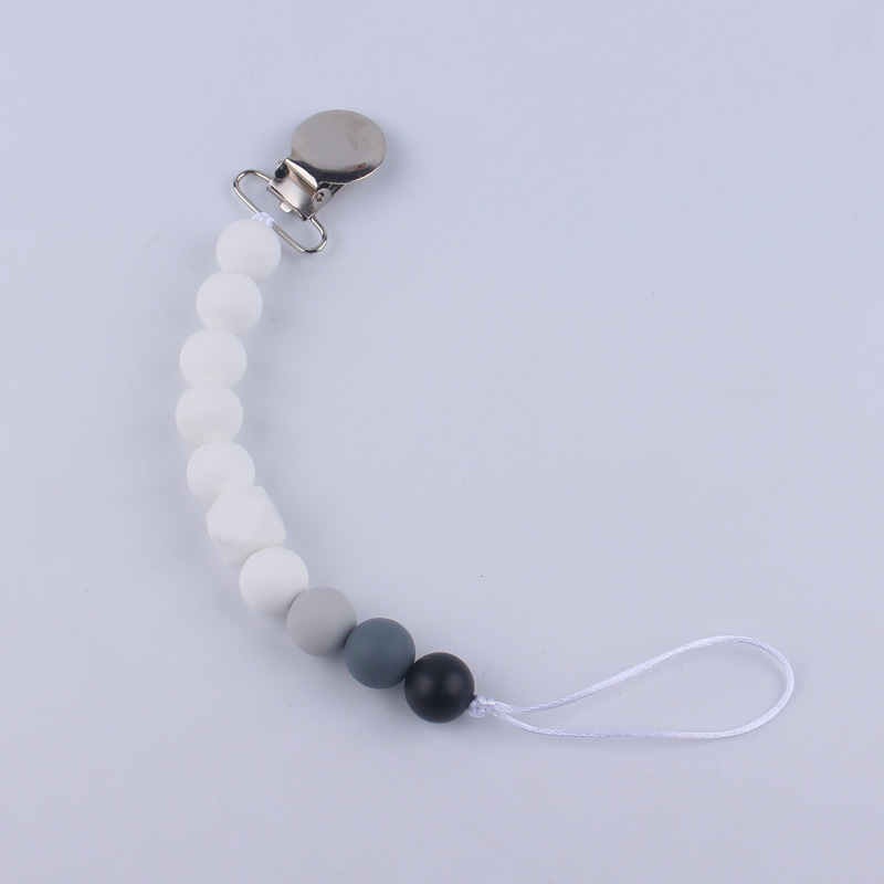 Nuevos suministros para bebés Cadena de chupete DIY creativo contraste color cuentas de silicona mordedor anti-caída traje de cadena