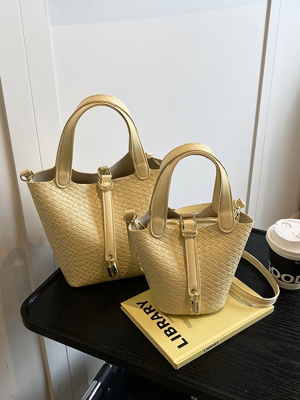 Bolso de cubo portátil con patrón tejido para mujer 2025 nuevo estilo coreano de lujo ligero de alta gama bolso de mensajero para niños de nicho