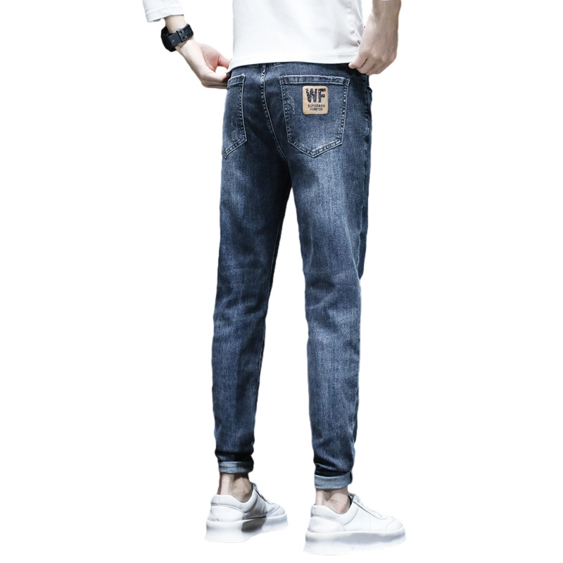 Otoño y invierno jeans de moda para hombres 2026 nuevos pantalones cónicos de pies pequeños primavera y otoño para hombres casuales nueve puntos
