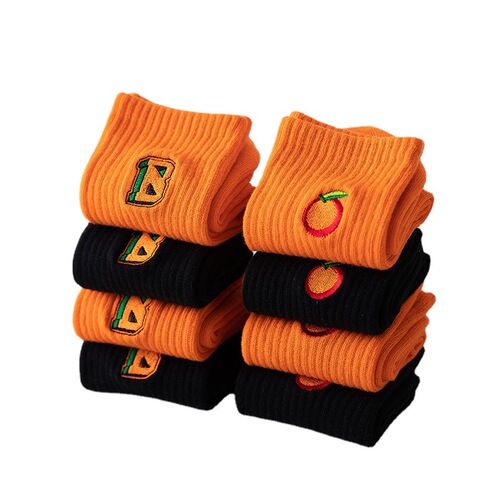 Korean Instagram trendy orange and black women's mid-calf socks with letters, streetwear skateboard style, high-waisted