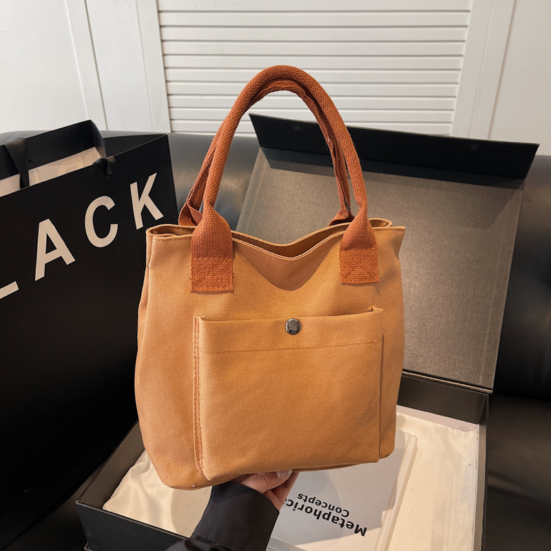 2024 nuevo bolso de lona para mujeres tela japonesa retro simple versátil Harajuku bolso de mano de color sólido casual de moda para mujeres