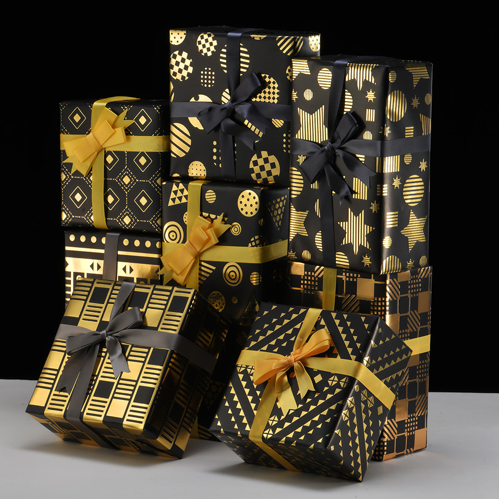 Nuevo papel de embalaje de caja de regalo grueso fondo negro estampado dorado estrella puntos rayas de papel de embalaje de regalo roll