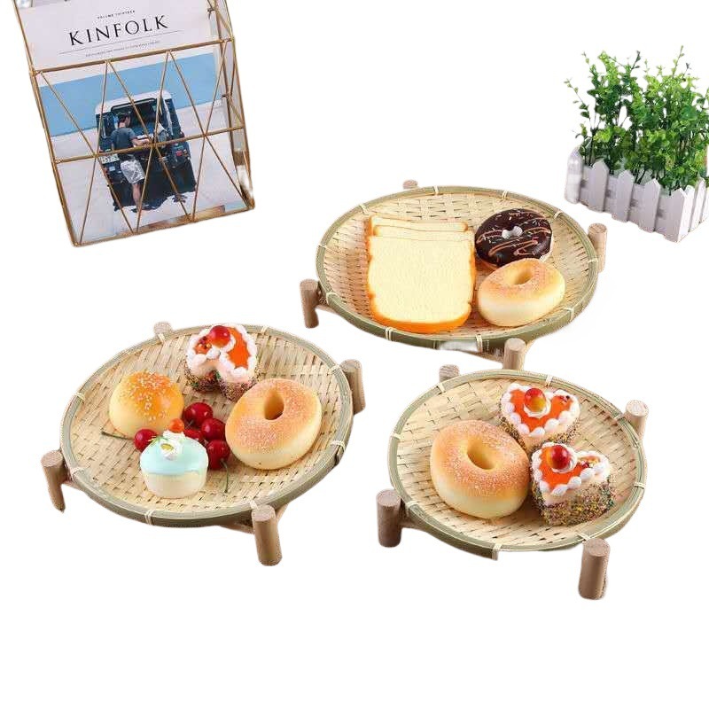 手作りの竹の編み製品の小さい竹のかごの丸い棚は箕のホテルのレストランの間食の果物のお菓子の皿のマントーのかごを振りかけます。|undefined
