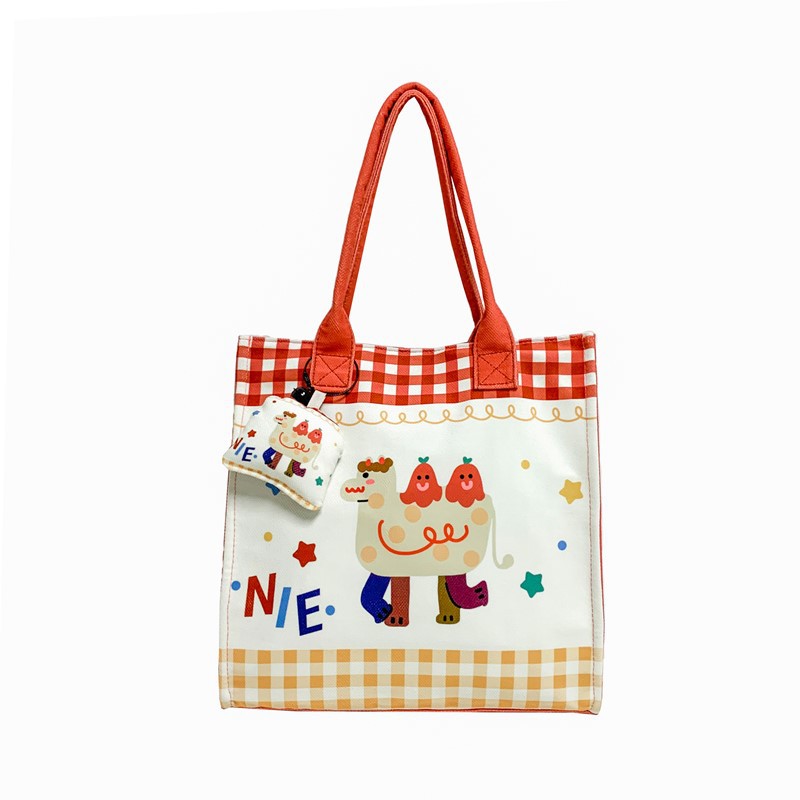 Caricatura de niños y niñas, bolsos de hombro de gran capacidad, bolsos de nicho de diseño, bolsos de mano nuevos lindos para niñas