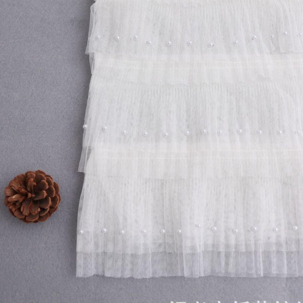 工厂直销柔软网布白色褶皱蛋糕纱裙加珍珠 时尚童装纱裙网纱面料