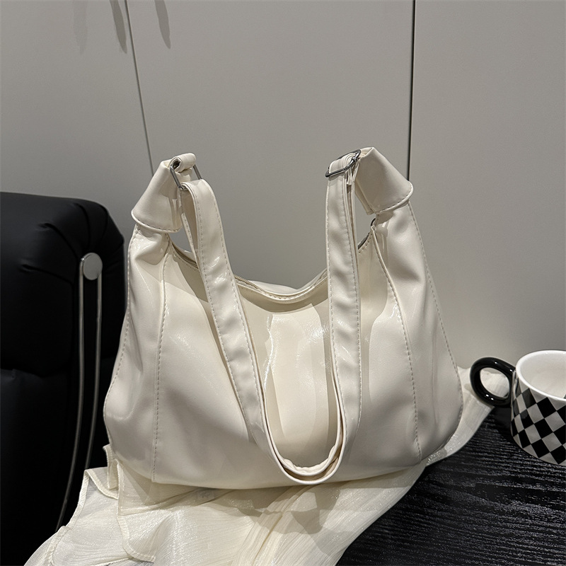 relajado cera de piel bolso de mujer 2025 nuevo estilo primavera y verano de moda de viaje bolsa de mano ocio versátil mochila