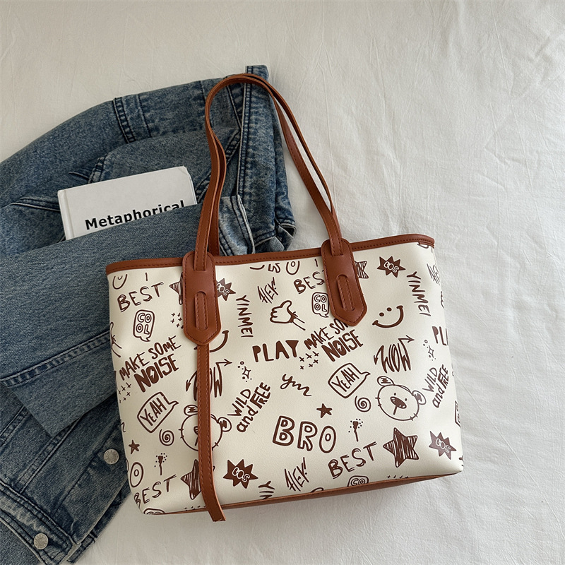 Bolsa de hombro de gran capacidad para mujeres, bolso de alta calidad, bolso grande, 2024 nuevo estilo de moda, bolso de clase de graffiti