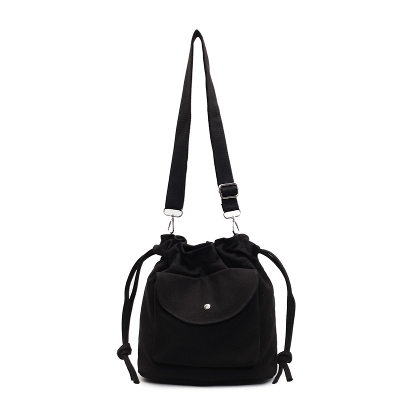 Bolsa de cubo de lona de moda de comercio exterior para mujeres 2025 nuevo estilo versátil bolso de hombro simple ocio nicho plegado mochila