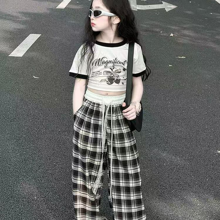 Traje de niña 2025 nuevos niños verano estilo occidental moda dibujos animados manga corta casual niños grandes pantalones de pierna ancha dos piezas