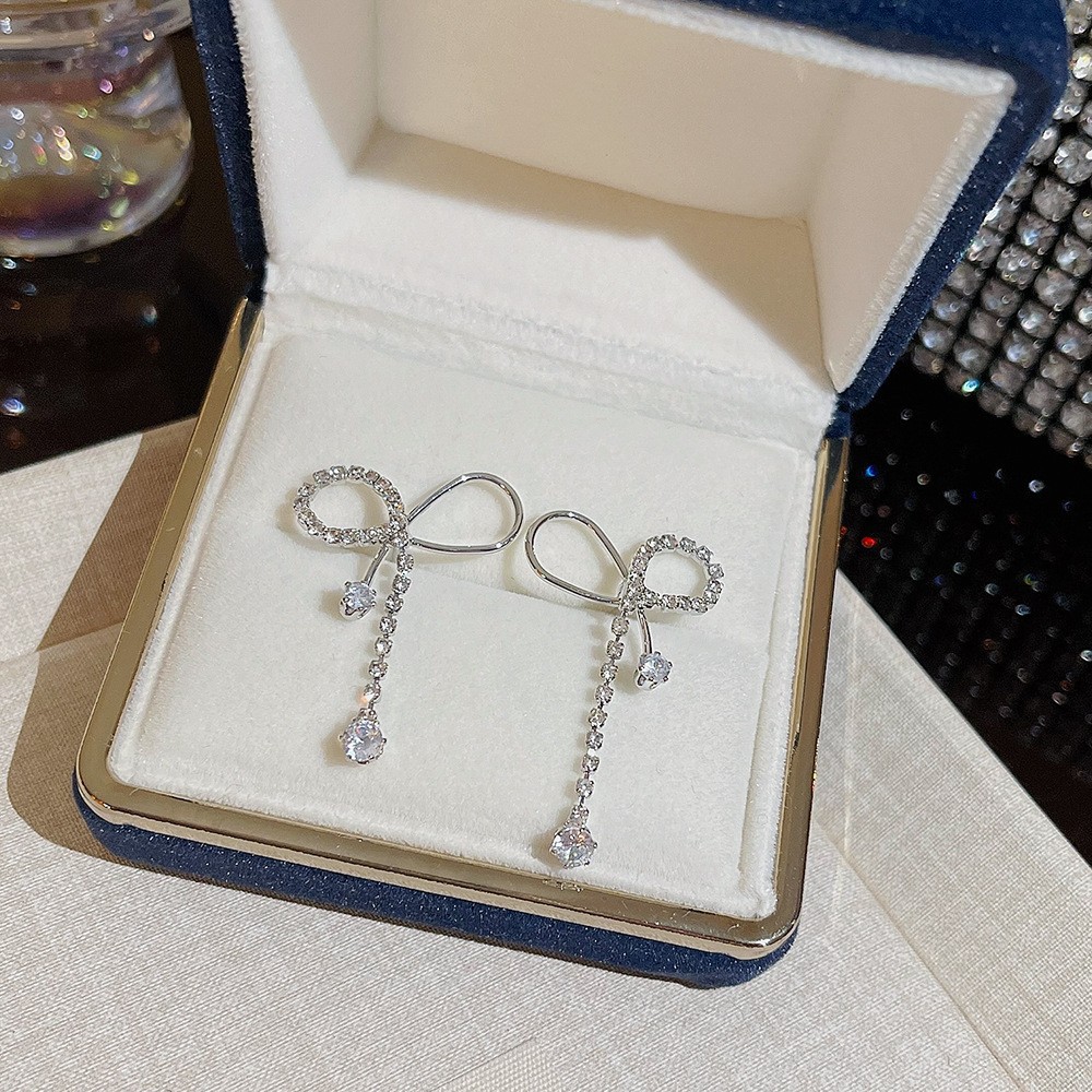 S925 aguja de plata elegante borla pendientes de alta gama simple cara de adelgazamiento pendientes de todo fósforo estilo coreano nuevos pendientes de moda al por mayor