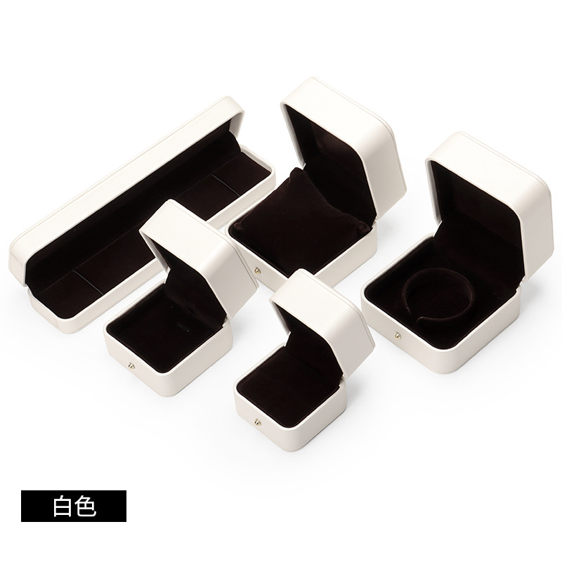 Caja de joyería de cuero de PU de borde dorado redondeado al por mayor caja de regalo de joyería de gama alta caja de reloj caja de joyería colgante de anillo